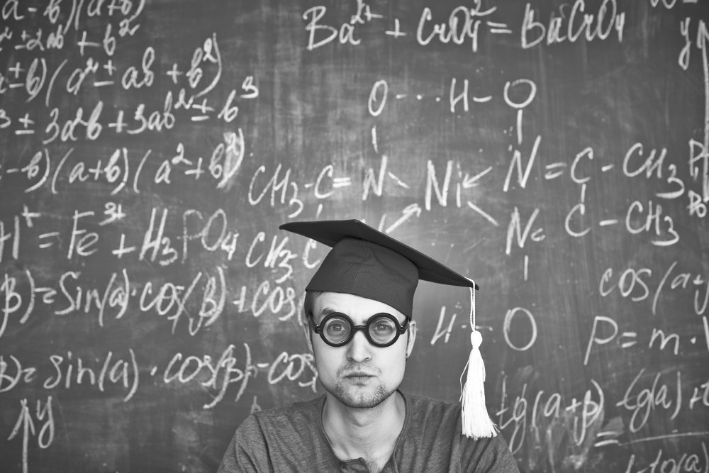 a man in a graduation cap and glasses